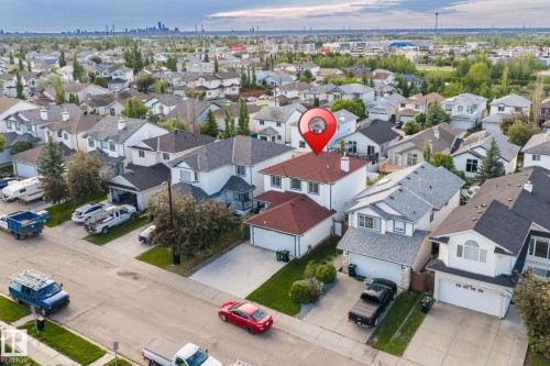 Residential neighborhood featuring detached properties with varying rooflines and exterior finishes - 1906 37B Av, Edmonton, AB 