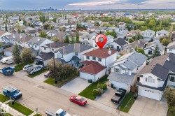 Residential neighborhood featuring detached properties with varying rooflines and exterior finishes - 