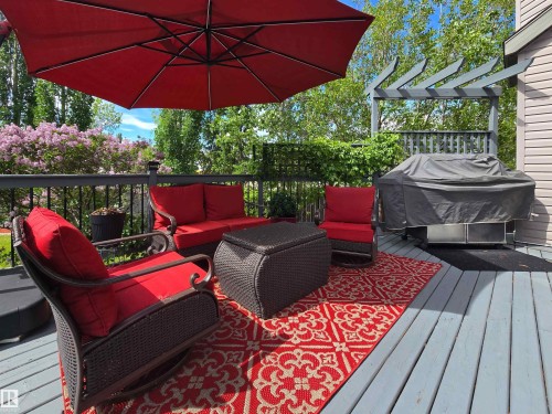 Spacious outdoor deck featuring gray wood-finish flooring - 704 Wildwood Point(E), Edmonton, AB 
