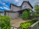 Gray siding exterior with contrasting trim, featuring a covered front entry - 704 Wildwood Point(E), Edmonton, AB 