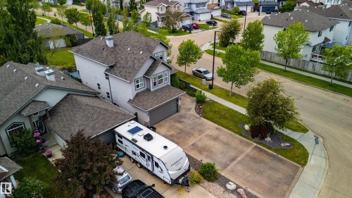 Modern two-story residence with light gray siding and a dark shingle roof - 704 Wildwood Point(E), Edmonton, AB 