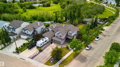 Two-story residence featuring a gabled roof and light gray siding - 704 Wildwood Point(E), Edmonton, AB 
