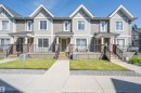 Townhome exterior featuring horizontal siding and gabled roof accents - 29 1150 Windermere Way, Edmonton, AB 