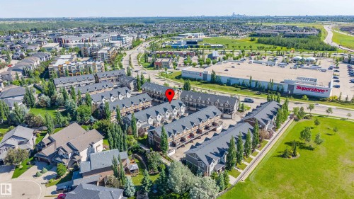 Aerial perspective showcasing a residential development with multiple townhome-style units - 29 1150 Windermere Way, Edmonton, AB 