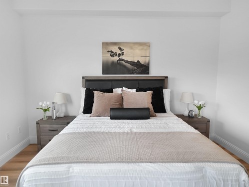 White walls with light wood-finish flooring - 104 14612 125 Street, Edmonton, AB 
