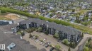 Multi-story apartment building featuring dark grey siding and light grey accents - 117 1204 156 Street, Edmonton, AB  -  