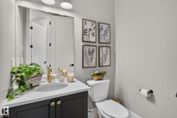 Modern vanity with a white countertop and oval undermount sink - 