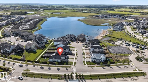 Lakeside community featuring modern residential architecture, a private beach area, and surrounding green spaces - 14 Jane Point(E), St. Albert, AB 