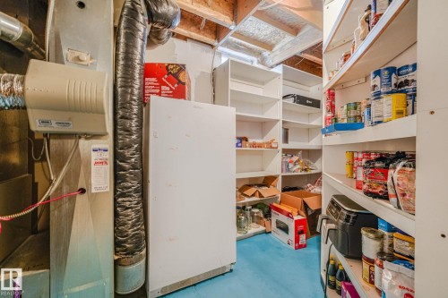 Utility area featuring a furnace, humidifier, and flexible ductwork - 98 Bridgeport Wynd, Leduc, AB 