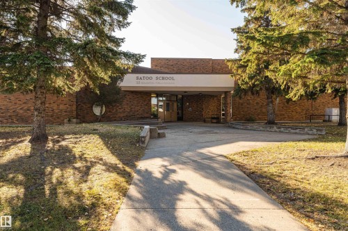 Brick exterior featuring a prominent covered entrance - 1612 80A Street, Edmonton, AB 