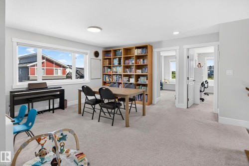 Expansive room featuring light neutral wall paint and plush carpet flooring - 30 Rosewood Way, St. Albert, AB 