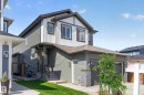 Contemporary two-story residence featuring a two-tone facade with horizontal siding and vertical paneling - 30 Rosewood Way, St. Albert, AB 