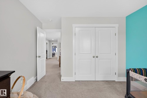 Double panel doors featuring brushed nickel hardware - 30 Rosewood Way, St. Albert, AB 