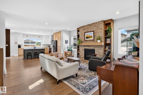 Expansive living area with wood-finish flooring - 30 Rosewood Way, St. Albert, AB 
