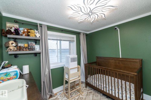 Room featuring painted green walls and a textured ceiling - 143 48 3400 Street W, Stony Plain, AB 