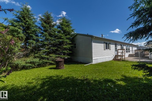 White siding exterior with a pitched roofline - 143 48 3400 Street W, Stony Plain, AB 