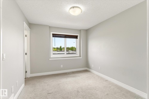 Room featuring neutral gray walls and light-colored carpeting - 47 330 Bulyea Road, Edmonton, AB - Indoor Photo Showing Other Room