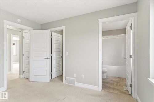 Interior room with light gray walls and beige carpet flooring - 47 330 Bulyea Road, Edmonton, AB - Indoor Photo Showing Other Room