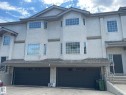 Stucco exterior with multiple bay windows and prominent white trim - 2 1295 Carter Crest Road, Edmonton, AB  - Outdoor 