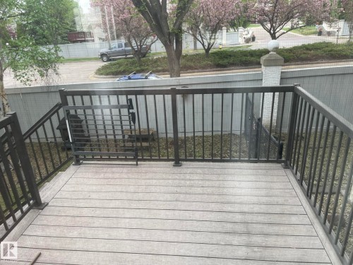 Composite deck with dark metal railings and gate - 2 1295 Carter Crest Road, Edmonton, AB - Outdoor With Exterior