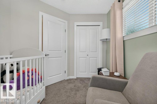 Neutral-toned walls with carpeted flooring - 2116 Maple Road, Edmonton, AB 