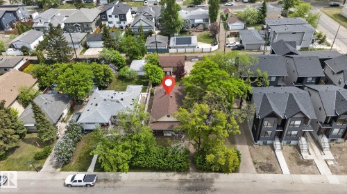 Aerial perspective showcasing a property featuring a pitched roof and surrounding mature trees - 9821 153 Street, Edmonton, AB - Outdoor With View