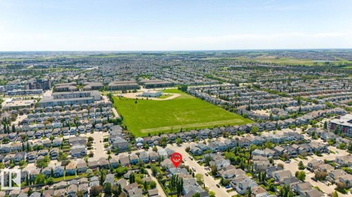 Aerial perspective showcasing a residential neighborhood with varied housing styles - 1007 Macewan Cl, Edmonton, AB 
