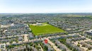Aerial perspective showcasing a residential neighborhood with varied housing styles - 1007 Macewan Cl, Edmonton, AB 