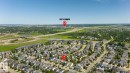 Aerial perspective showcasing a residential neighborhood with varied housing styles - 1007 Macewan Cl, Edmonton, AB 
