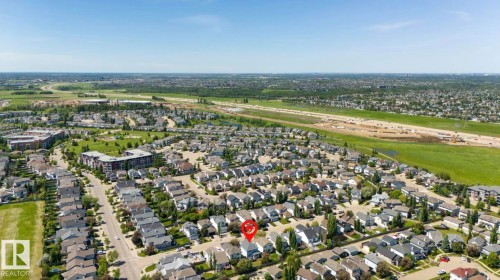 Aerial neighborhood overview featuring residential properties, green spaces, and established infrastructure - 1007 Macewan Cl, Edmonton, AB 