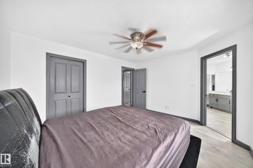 Spacious room featuring light-toned flooring and white walls - 1549 37C Avenue, Edmonton, AB 