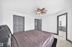Spacious room featuring light-toned flooring and white walls - 