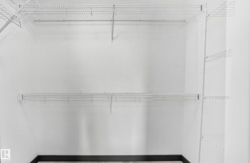 Closet featuring white wire shelving - 1549 37C Avenue, Edmonton, AB 