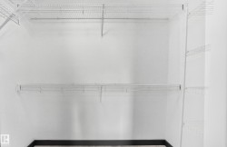 Closet featuring white wire shelving - 