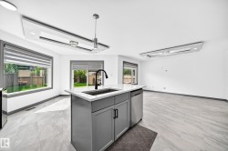 Kitchen island with a built-in sink and dishwasher - 
