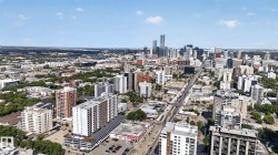 Expansive urban skyline featuring numerous high-rise buildings and a dense city environment - 