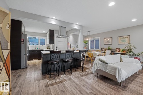 Open-concept main floor living space with recessed lighting throughout - 10328 73 Street, Edmonton, AB 