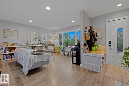Main floor living room & entrance with recessed lighting throughout - 10328 73 Street, Edmonton, AB 