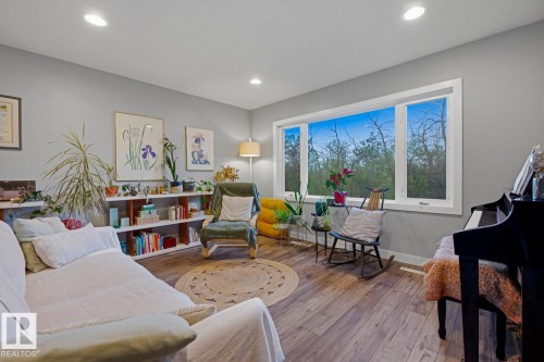 Main floor living room, with unobstructed views of Fulton Ravine across the street - 10328 73 Street, Edmonton, AB 