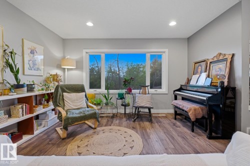 Main floor living room, with unobstructed views of Fulton Ravine across the street - 10328 73 Street, Edmonton, AB 