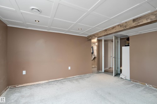 Room featuring wall-to-wall carpeting, neutral wall paint, and a white coffered ceiling with recessed lighting - 4 Wentworth Crescent, St. Albert, AB 