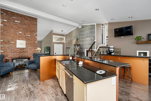 Open-concept main living area with wood-finish flooring - 4 Wentworth Crescent, St. Albert, AB 