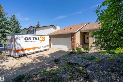 Single-story residence featuring a front entry, attached garage, and a combination of stucco and brick exterior finishes - 4 Wentworth Crescent, St. Albert, AB 