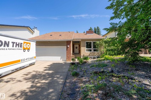 Single-story residence featuring a two-car garage, brick accents, and a brown shingle roof - 4 Wentworth Crescent, St. Albert, AB 