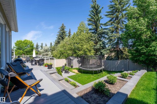 Multi-level deck with glass panel railings - 4 Wentworth Crescent, St. Albert, AB 
