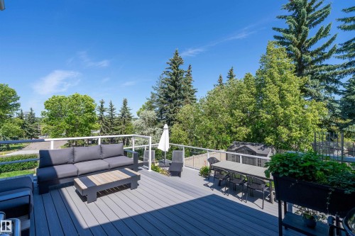 Spacious outdoor deck featuring gray composite decking and white railings - 4 Wentworth Crescent, St. Albert, AB 