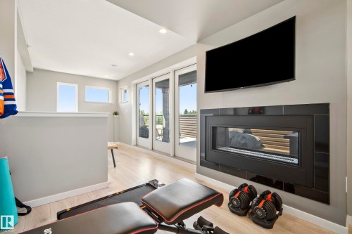 #118 1304 Rutherford Rd Sw, Edmonton, AB - Indoor Photo Showing Living Room With Fireplace