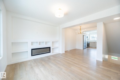7032 Rosenthal Drive, Edmonton, AB - Indoor Photo Showing Living Room With Fireplace