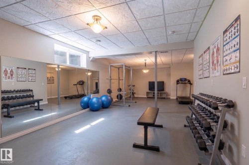 This is a virtually staged photo. Ample room for a gym, pool table or home theater in this space. - 20 1407 Glastonbury Boulevard Nw, Edmonton, AB 