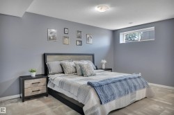 Spacious room featuring light gray walls, wood-finish flooring, and a recessed window - 